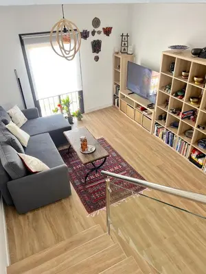 a living room with a couch and a table at GATU Rubí in El Puerto de Santa María