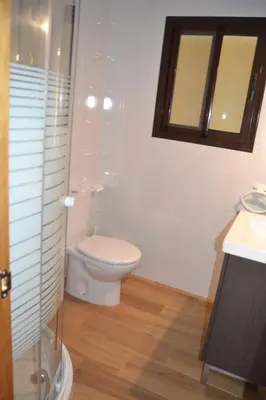 a bathroom with a toilet and a sink and a mirror at CASA Marimonte in Conil de la Frontera