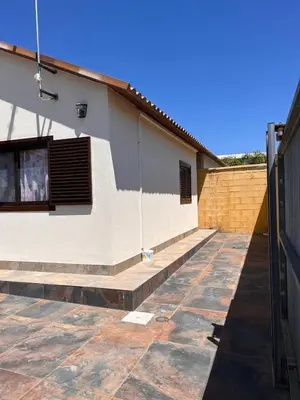 a house with a patio and a fence at CASA Marimonte in Conil de la Frontera