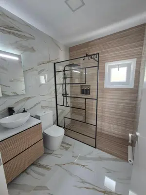 a bathroom with a toilet and a sink and a shower at Casitalola in Conil de la Frontera