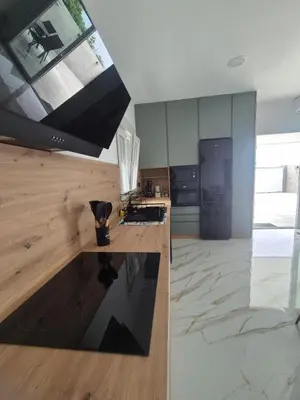 a kitchen with a counter and a large window at Casitalola in Conil de la Frontera