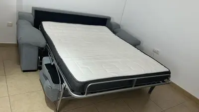 a bed in a room with a mattress at Apto cerca de playa Regla con garaje in Chipiona