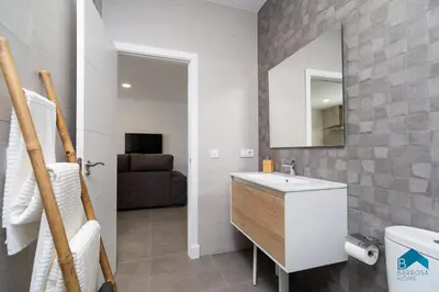 a bathroom with a sink and a mirror at Sauz A in Novo Sancti Petri