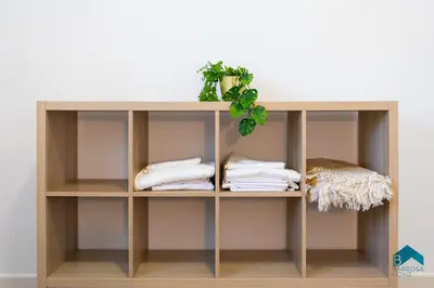 a wooden shelf with towels on it at Sauz A in Novo Sancti Petri
