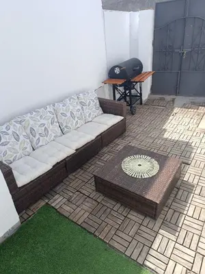 a living room with a couch and a table at Apartamentos Bajo Guía in Sanlúcar de Barrameda