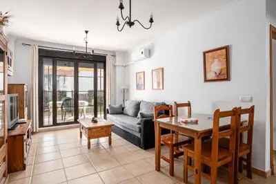 a living room with a couch and a table at coto 7 8 in Chiclana de la Frontera