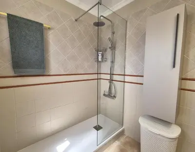 a shower with a glass door in a bathroom at Dolce Vita Chiclana in Chiclana de la Frontera