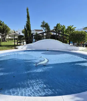 a pool of water with a skateboard ramp at Dolce Vita Chiclana in Chiclana de la Frontera
