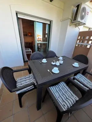 a black table and chairs in a room at Apartamento Riviera in Novo Sancti Petri