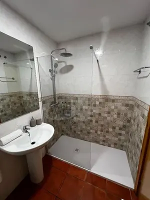 a bathroom with a shower and a sink and a shower at Apartamento Riviera in Novo Sancti Petri