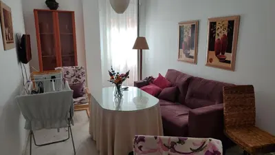 a living room with a couch and a table at El Falla in Cádiz
