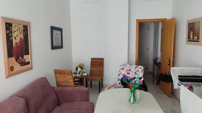 a living room with a couch and a table at El Falla in Cádiz