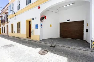 a garage door on the side of a building at Brisa Jerez Suites in Jerez de la Frontera