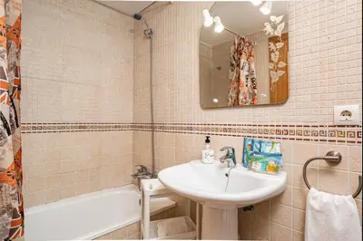 a bathroom with a sink and a bath tub at coto 2 18 in Chiclana de la Frontera