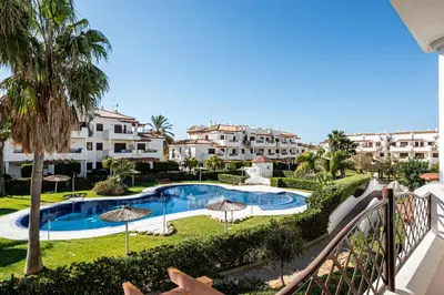 a view of the pool from the balcony of a resort at coto 9 16 in Chiclana de la Frontera