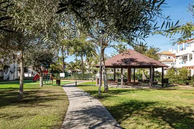 a path in a park with a gazebo at coto 9 16 in Chiclana de la Frontera