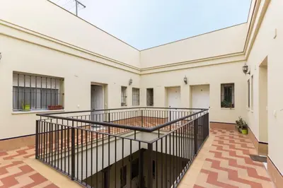 an empty room with a staircase in a building at Ribera del río - Centro in El Puerto de Santa María