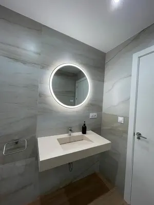a bathroom with a sink and a mirror at Sunset Palm in El Puerto de Santa María