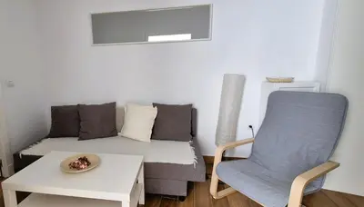 a small living room with a couch and a table at Cobos by Gades Gestión in Cádiz