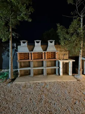 a picnic table with four vases on top of it at casitas de las palmeras in Cádiz