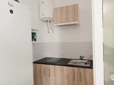 a kitchen with a sink and a counter top at Apartamento patio Andaluz in Rota