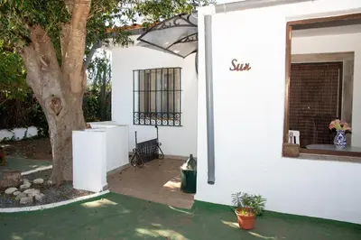 a kitchen with a sink and a washing machine at Casa Rural con Jacuzzi en Conil de la Frontera in Cádiz