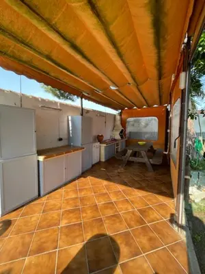 a large kitchen with an open floorplan with at Villa Clara Chiclana in Chiclana de la Frontera
