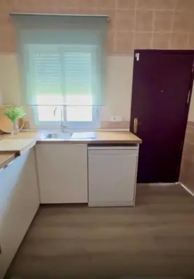 a kitchen with a sink and a window at Azul Sancti Petri in Chiclana de la Frontera