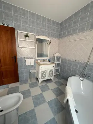 a bathroom with a sink and a tub and a toilet and a bath tub at Azul Sancti Petri in Chiclana de la Frontera