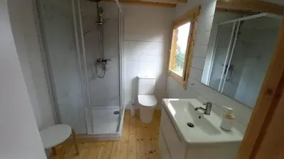a bathroom with a shower and a sink and a toilet at Cosy Cabin in Cádiz in Chiclana de la Frontera
