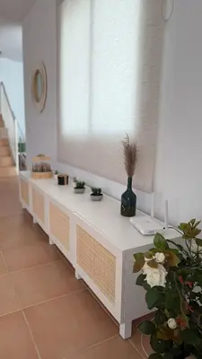 a white counter with a window with plants on it at Mirador las Cumbres Conil - Piscina Jardín XL in Conil de la Frontera