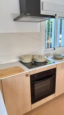 a kitchen with three bowls on a stove top at Mirador las Cumbres Conil - Piscina Jardín XL in Conil de la Frontera