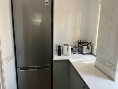 a kitchen with a stainless steel refrigerator and appliances at Villa Costa Ballena in Rota