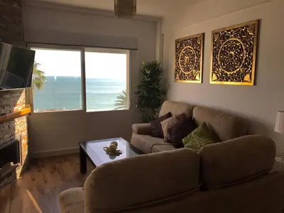a living room with a couch and a table at Apartamento en Fuentebravia in El Puerto de Santa María