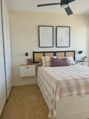 a bedroom with a bed and a ceiling fan at Apartamento Valdelagrana vistas al Mar in El Puerto de Santa María