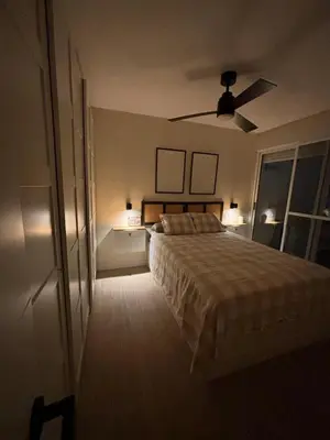 a bedroom with a bed and a ceiling fan at Apartamento Valdelagrana vistas al Mar in El Puerto de Santa María