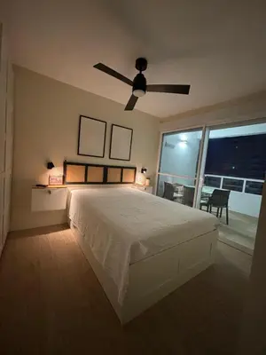 a bedroom with a bed and a ceiling fan at Apartamento Valdelagrana vistas al Mar in El Puerto de Santa María