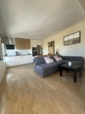 a living room with a couch and a table at Apartamento Valdelagrana vistas al Mar in El Puerto de Santa María