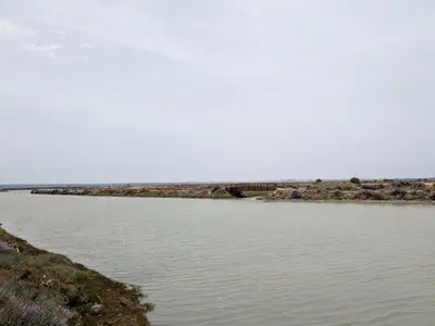 a body of water with a bridge in the background at Apartamento Victoria in San Fernando