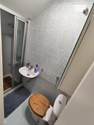a bathroom with a toilet and a sink at 4 dormitorios Valdelagrana in El Puerto de Santa María
