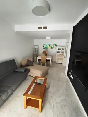 a living room with a couch and a coffee table at 4 dormitorios Valdelagrana in El Puerto de Santa María