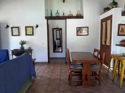 a dining room with a table and chairs at Casa Juan José in Conil de la Frontera