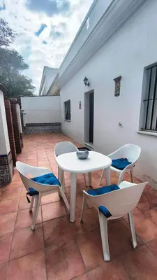 a white table and chairs on a patio at EL Lucernario in Jerez de la Frontera