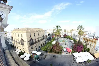 an aerial view of a city with a clock tower at Alojamiento Montero in Sanlúcar de Barrameda