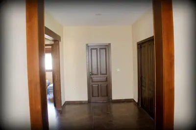 an empty room with two doors and a hallway at Villa Dana in Chiclana de la Frontera