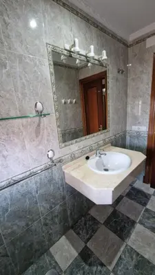 a bathroom with a sink and a mirror at La Barrosa - Chalet La Morenita in Chiclana de la Frontera