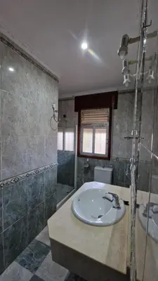 a bathroom with a sink and a shower at La Barrosa - Chalet La Morenita in Chiclana de la Frontera
