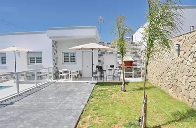 a villa with a swimming pool and a patio at El Rincon de Samuel in Conil de la Frontera