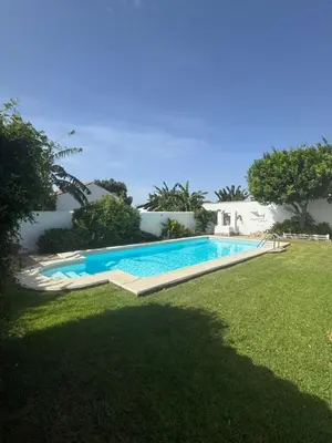 a swimming pool in the yard of a house at Viangel 1 in Conil de la Frontera