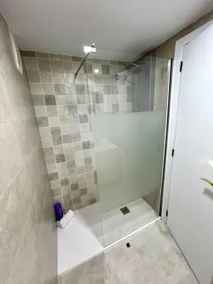 a shower with a glass door in a bathroom at GATU Malvasía- Valdelagrana in El Puerto de Santa María